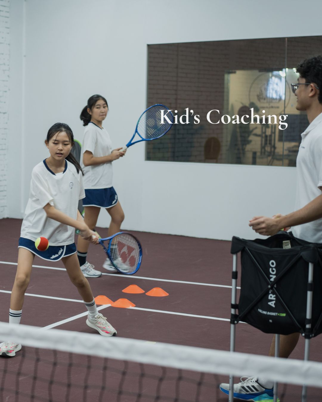 Kids group tennis coaching.