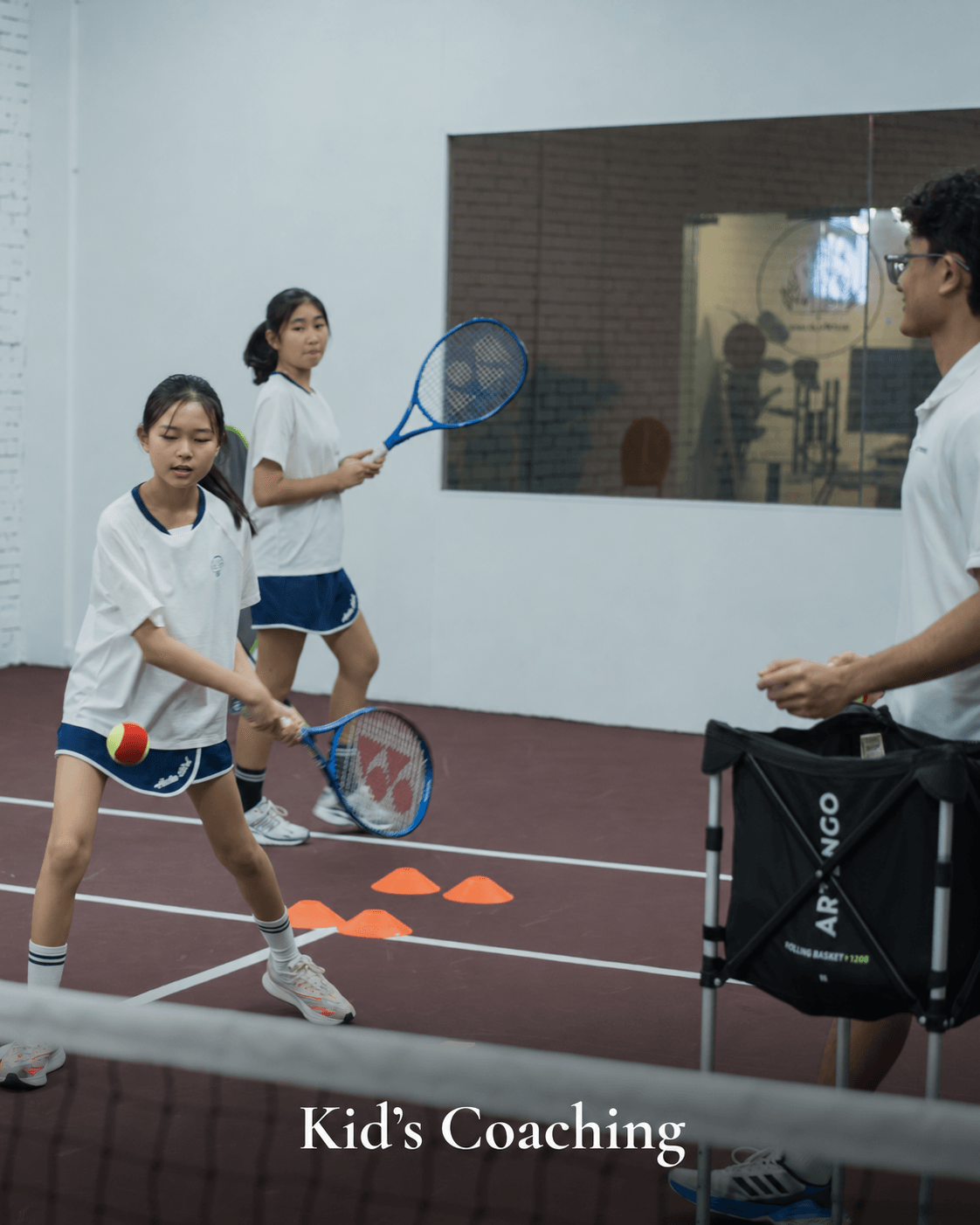 Kids group tennis coaching.